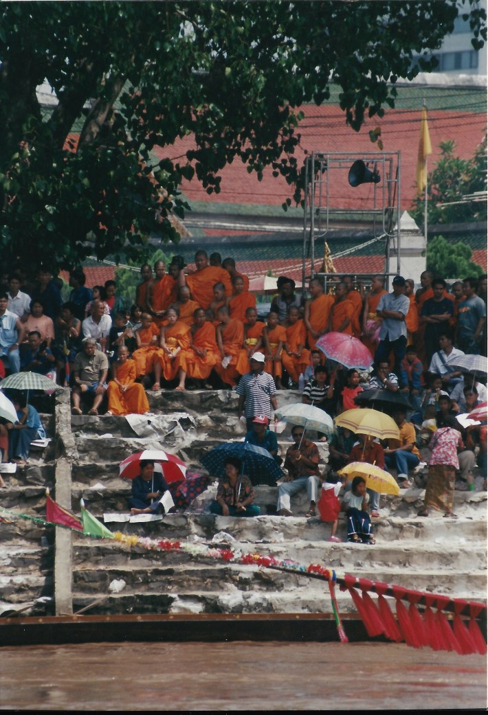 Orange-clad monks enjoy the show
