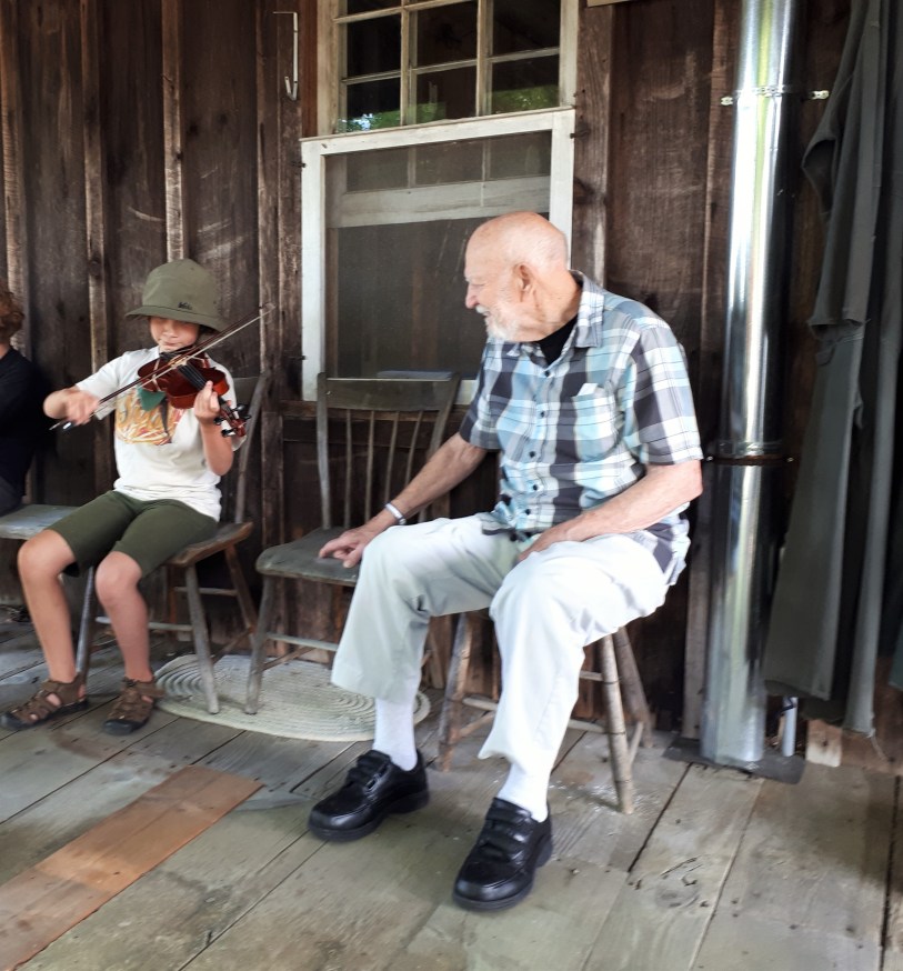 Granddaughter Entertaining her Great-Grandfather.